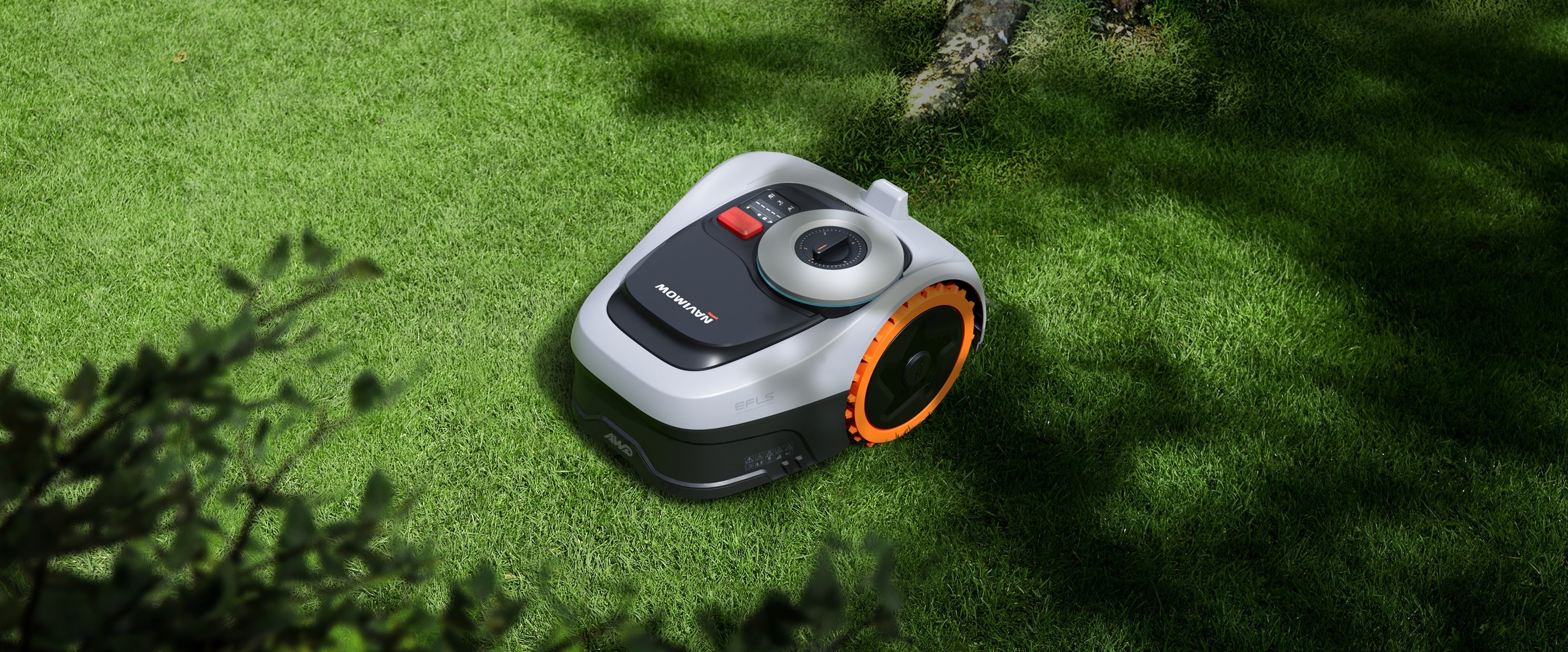 Navimow i105E robot lawn mower sits on a green lawn.