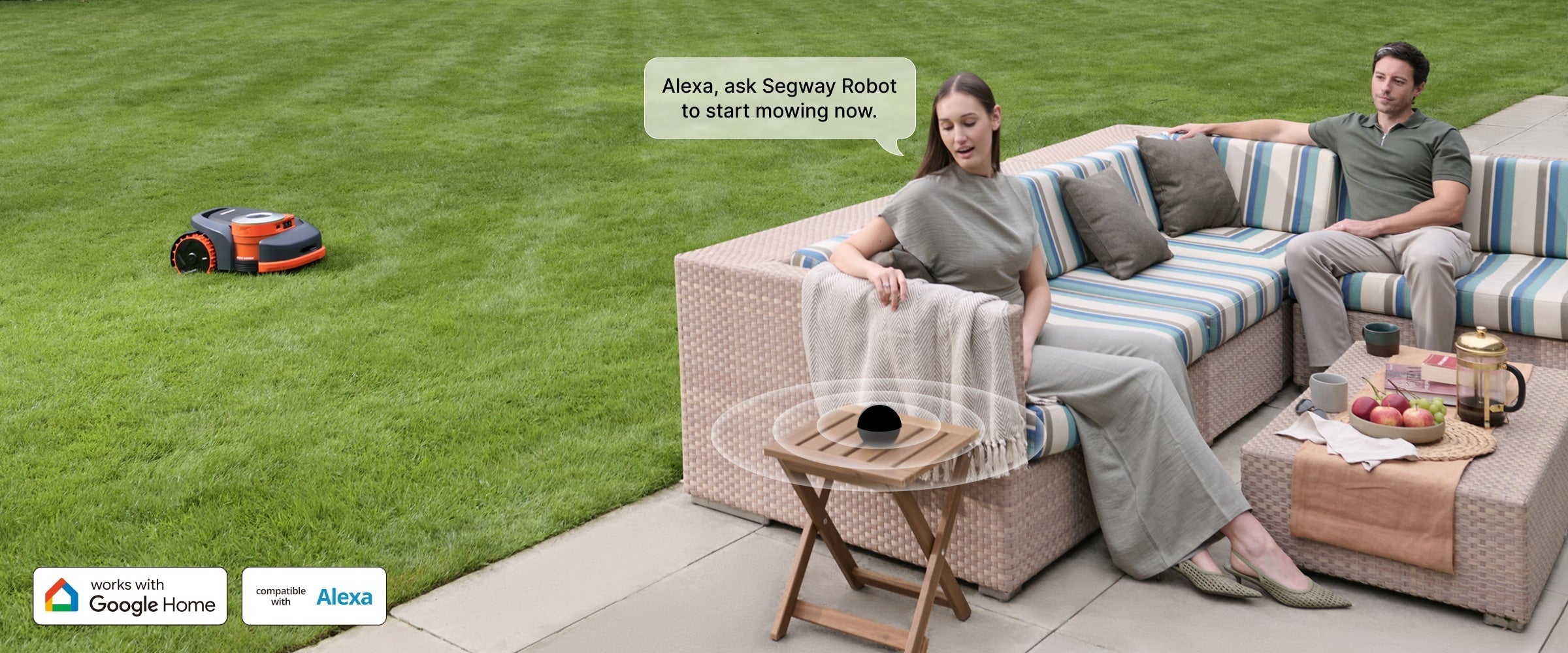 Segway Navimow robot lawn mower is mowing the green lawn.