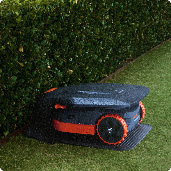 Segway Navimow i110E robot lawn mower parked in the rain.