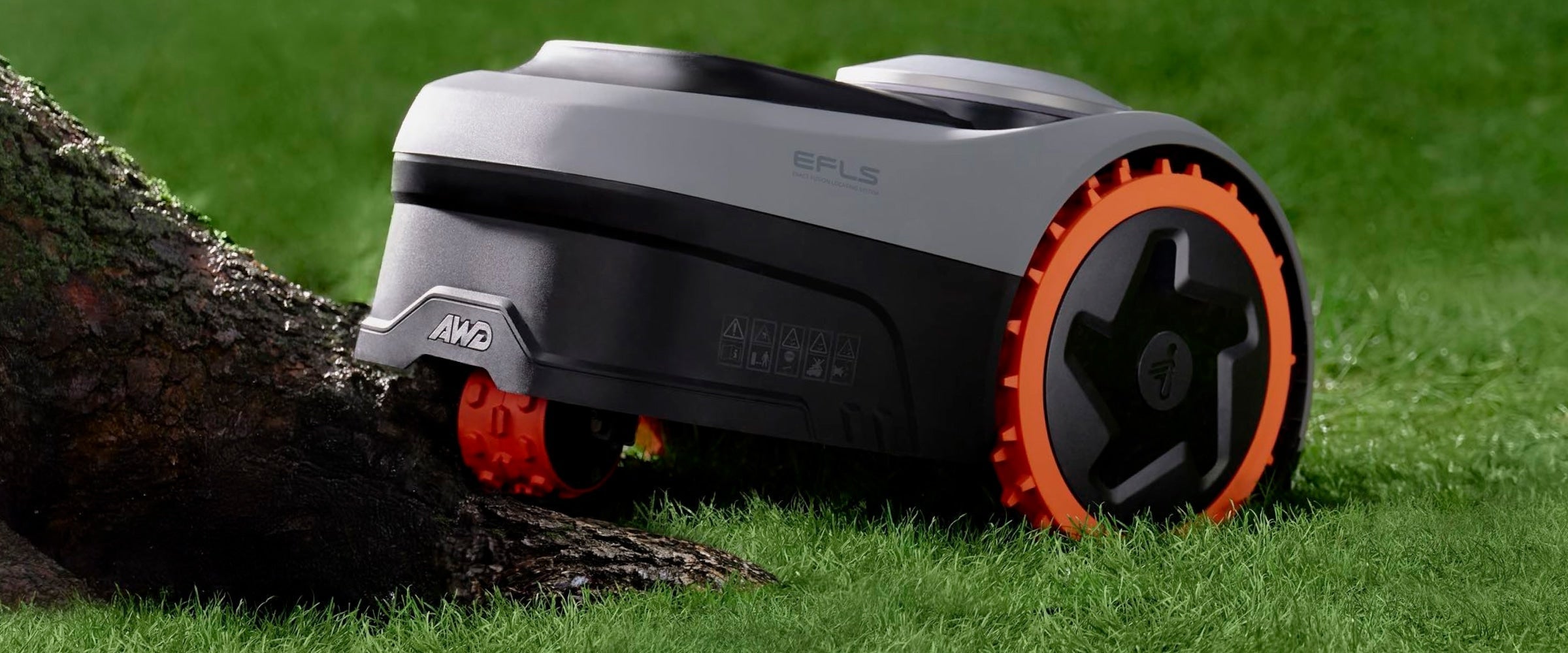 Segway Navimow i105E robot lawn mower sits on green grass.