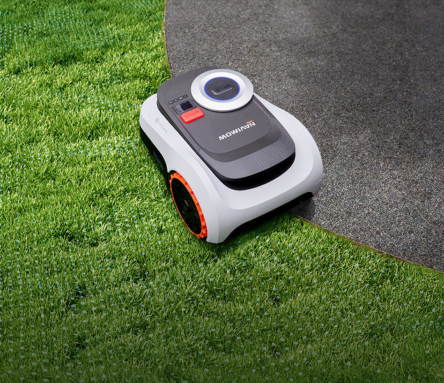 Segway Navimow i105E robot lawn mower mows the green grass.
